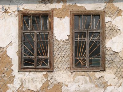 Two alone aged ruined urban windows