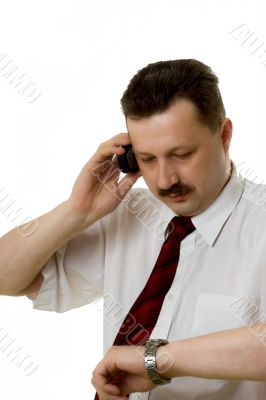 The man speaking by phone on a white background