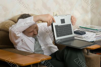 Young the man working on notebook at home