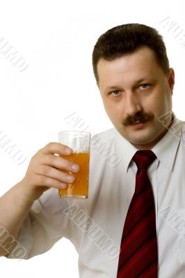 The young man drinking juice on a white background