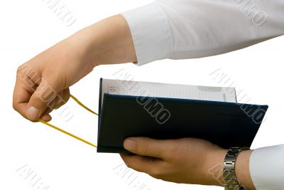 Bookmark in a notebook. Isolated. Close up.