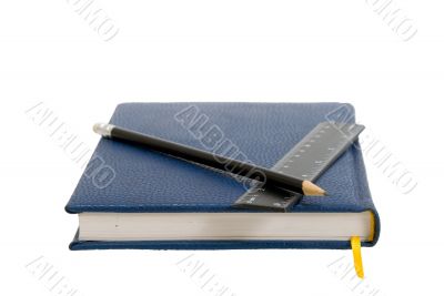 Dark blue notebook on a table. Close up.