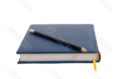Dark blue notebook on a table. Close up.