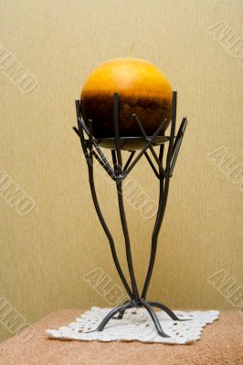 Decorative candlestick with a spherical candle