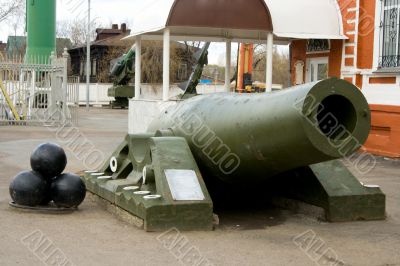 Old artillery piece with shells