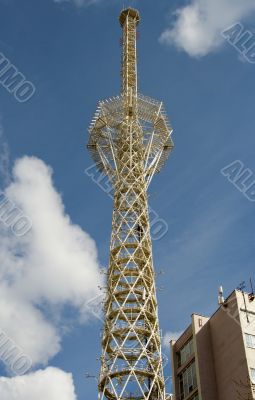 Television tower on a background of clouds