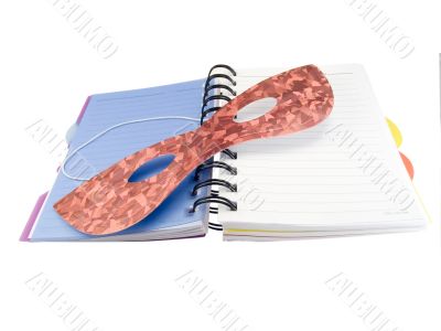 Notebook and mask for a carnival Notebook and mask for a carnival