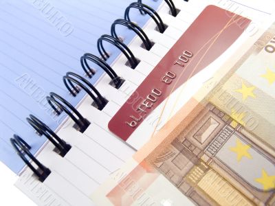 Notebook with Euro and a credit card