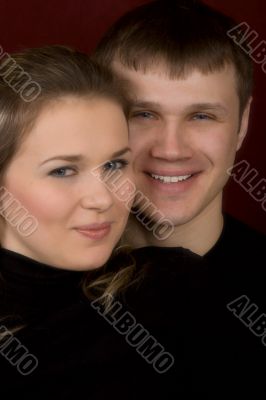 A smiling man and the woman close up