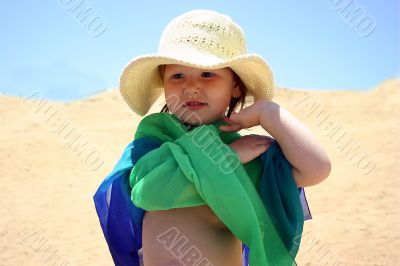 girl in green-blue scarf and a hat