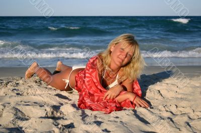 Blonde lying on the beach Blonde lying on the beach