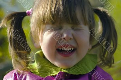 Emotional little girl with tails