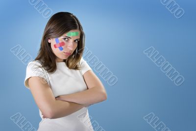 Woman with bandages on the face