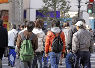 Teenagers crossing the street