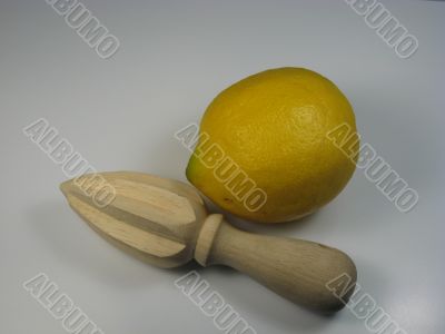 wooden juicer and lemon