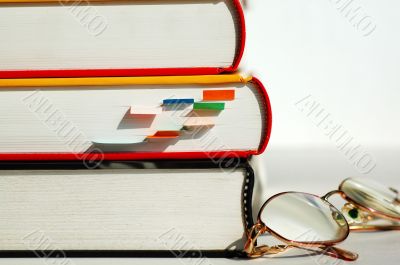 Three books and glasses
