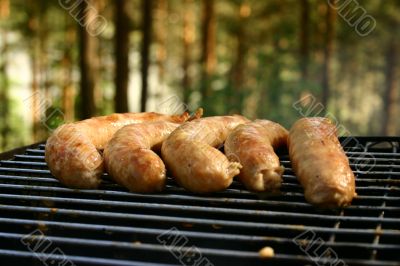 sausages on a grill