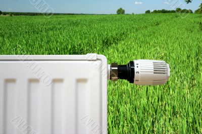 Radiator on a green field