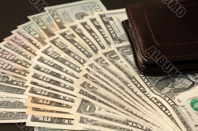 US dollars and leather wallet