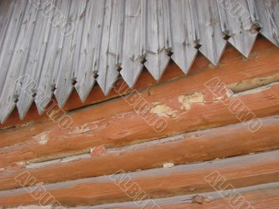 Old log wall and wooden roof