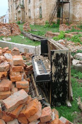 The Old Broken Piano Among Ruins