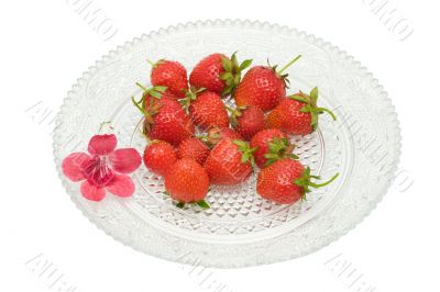 Strawberries on a glass dish, isolated on white