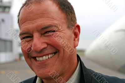 Smiling Man at Airport
