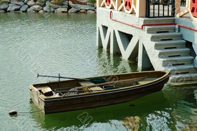 Rowboat beside marina stairs