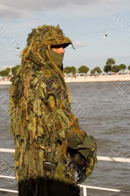 Military camouflaged solder.