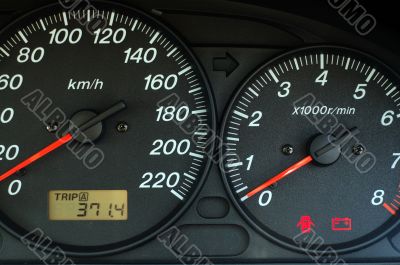 Car dashboard with speed and rpm dials