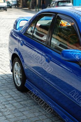 Rear view of blue sportive car