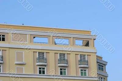 Yellow Condo and Blue Sky