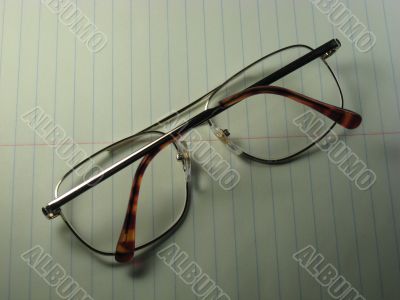 glasses on notepad