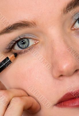 applying eye liner - makeup series