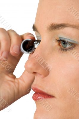 applying mascara over white