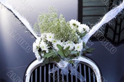 flowers on wedding car