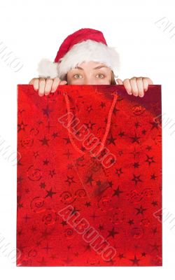 beautiful girl coming out of christmas bag