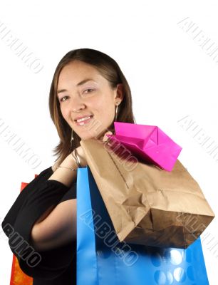 shopping girl with bags smiling at camera