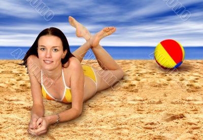 ball and girl at the beach