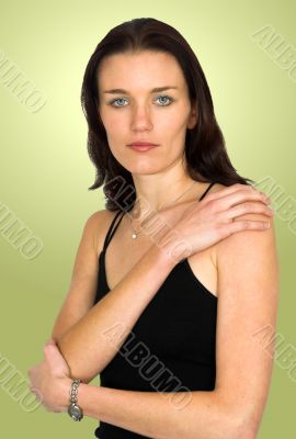 beautiful model in black over green background