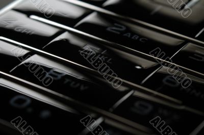 Close up shot of mobile keypad under dark