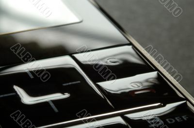 Close up shot of mobile keypad under dark