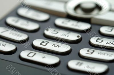 Close up shot of mobile keypad under light