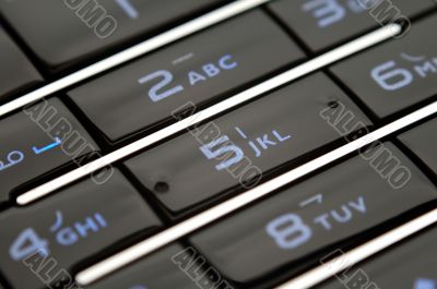 Close up shot of mobile keypad under light