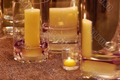 Different candleholders of glass