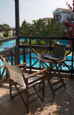 table with laptop and cup of coffee table with laptop and cup of coffee