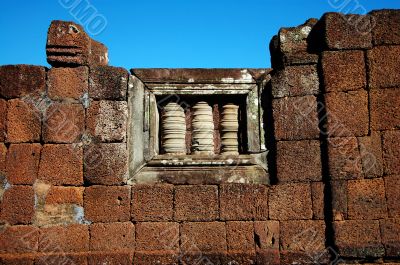 Window of an ancient stone wall in Siem Reap