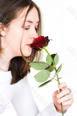 beautiful girl smelling rose
