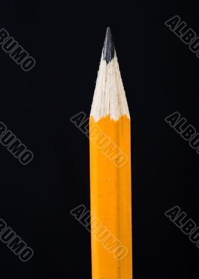 single pencil over black