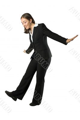 business woman balancing over white